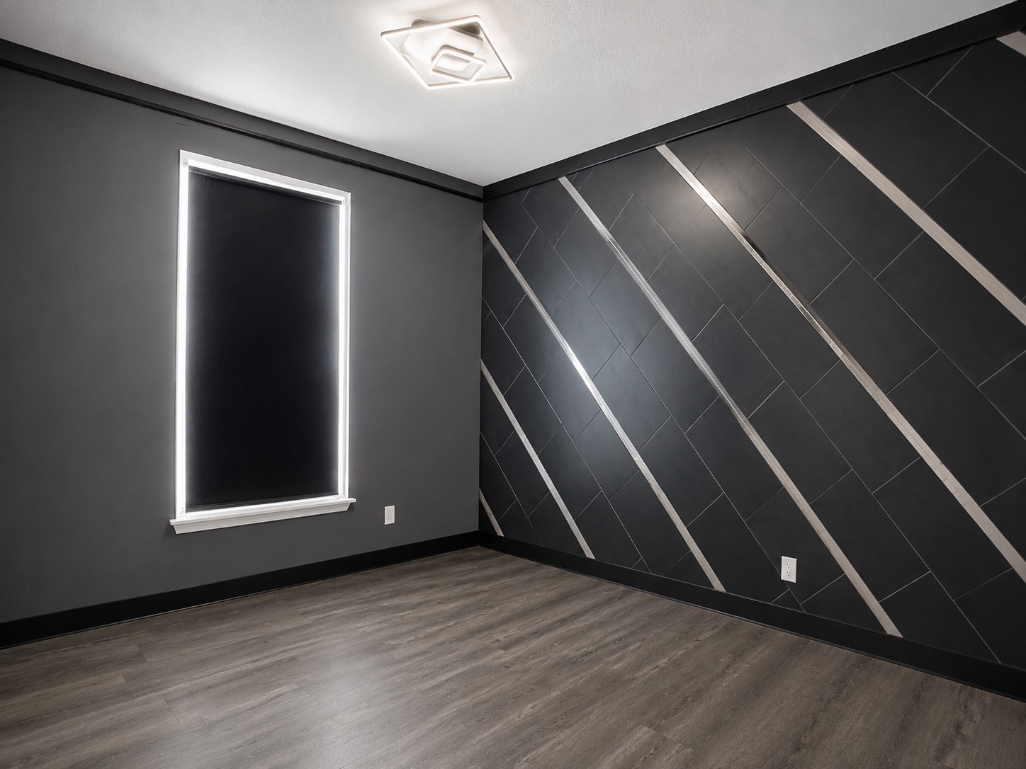 Deluxe studio with geometric accent wall and open floor plan